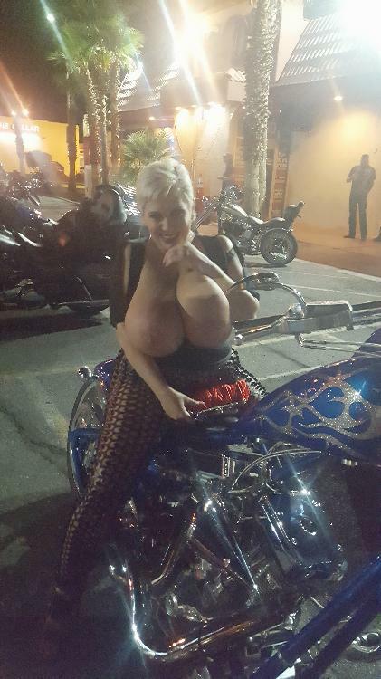 Claudia Marie huge fake tits on a motorcycle